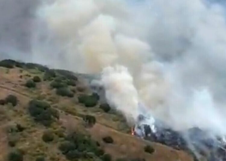 Growing brush fire triggers evacuation warnings in Orange County