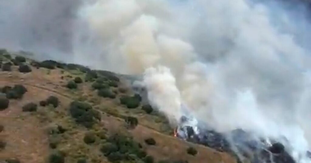 Growing brush fire triggers evacuation warnings in Orange County