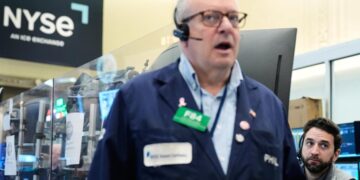 Wall Street rallies to the edge of its all-time high as oil prices ease