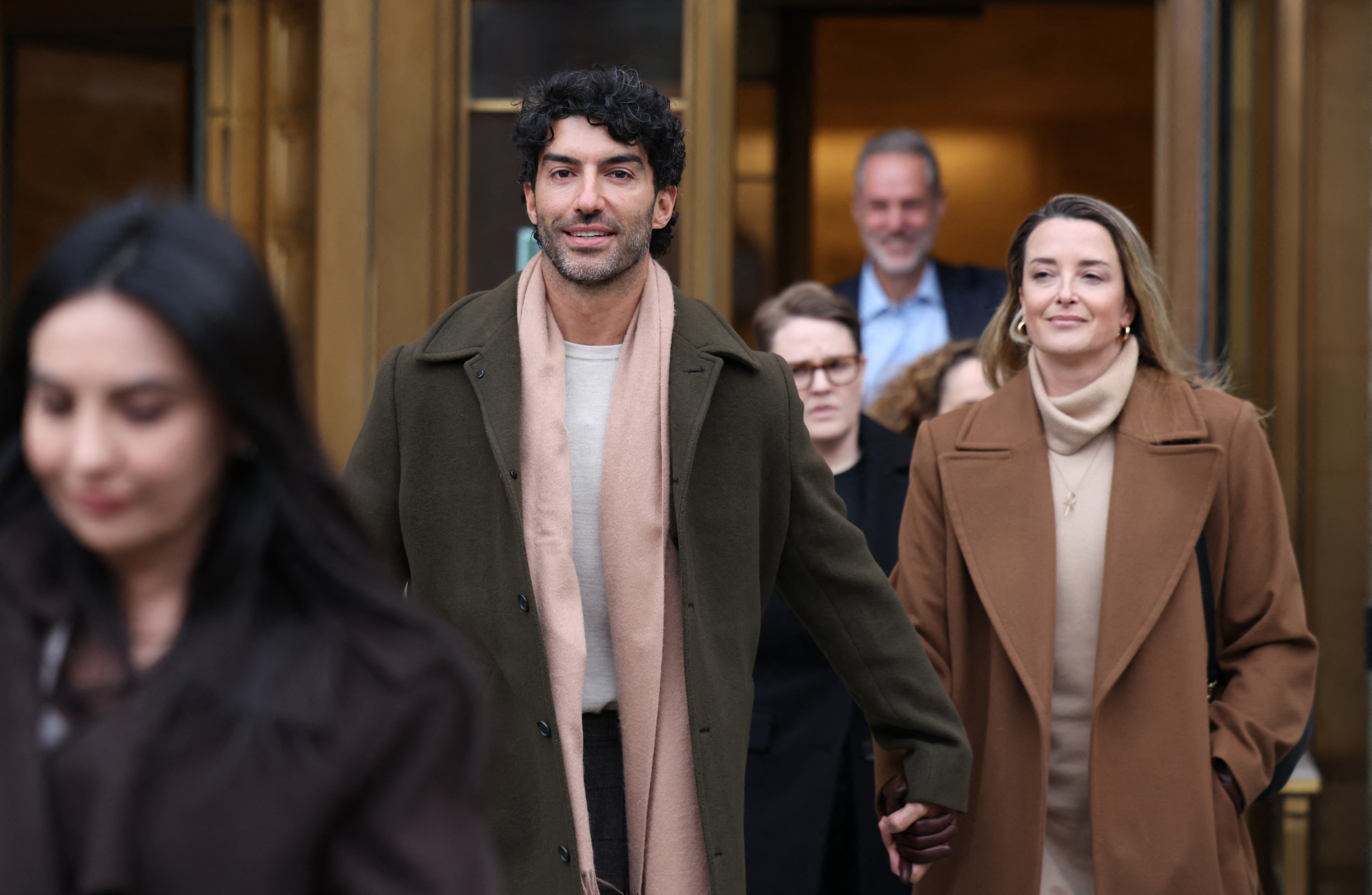Actor Justin Baldoni and his wife Emily Baldoni leaving federal court.