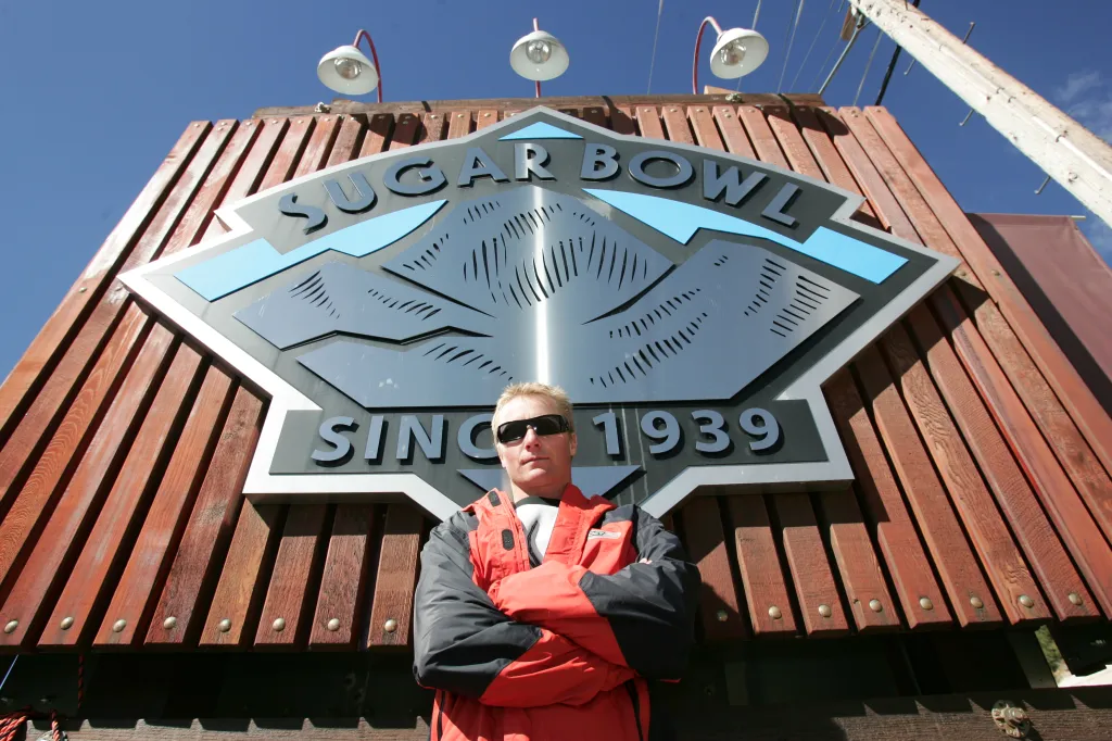 USA Ski Team member Daron Rahlves poses in front of the Sugar Bowl ski resort sign.