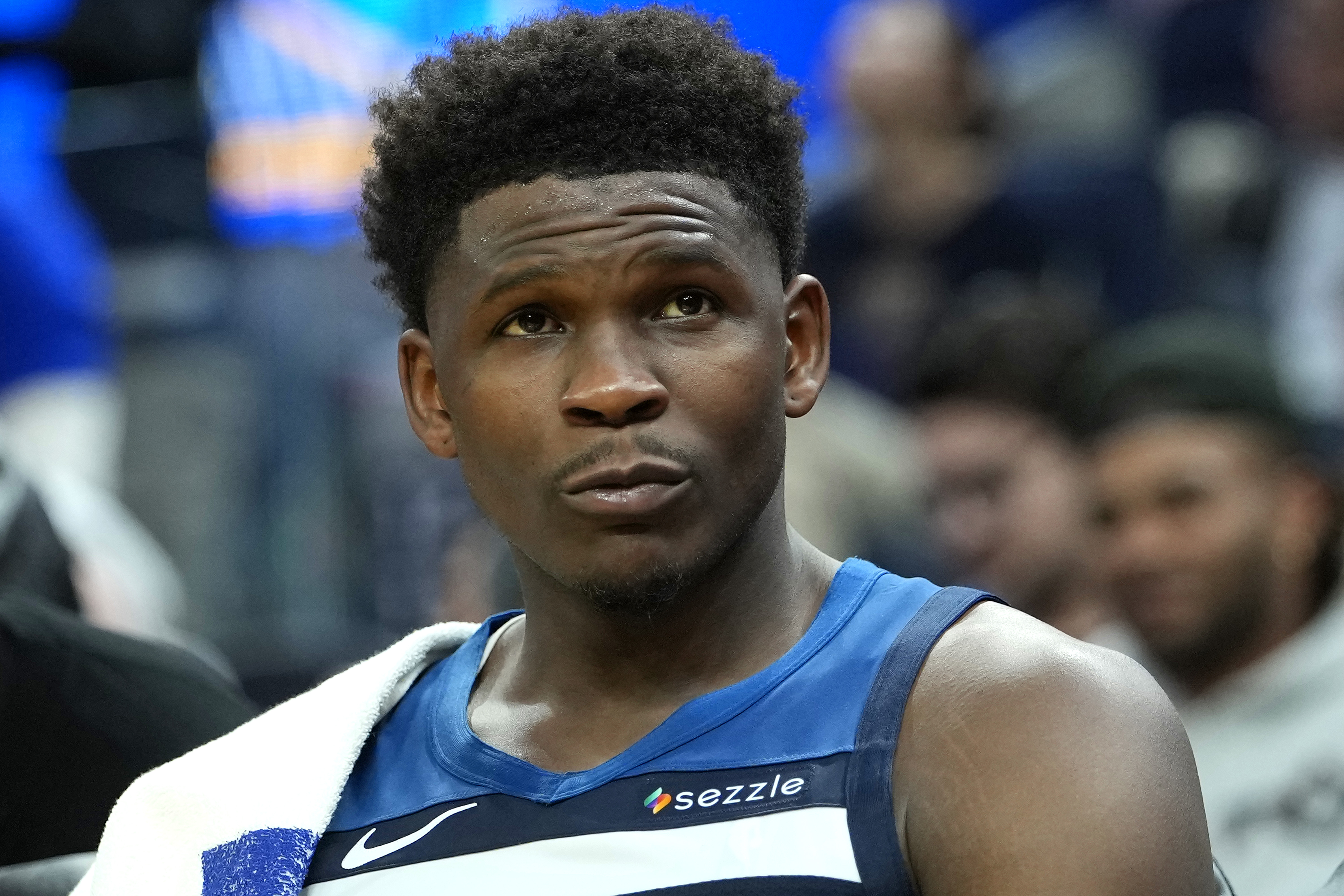 Anthony Edwards of the Minnesota Timberwolves looking on from the bench.