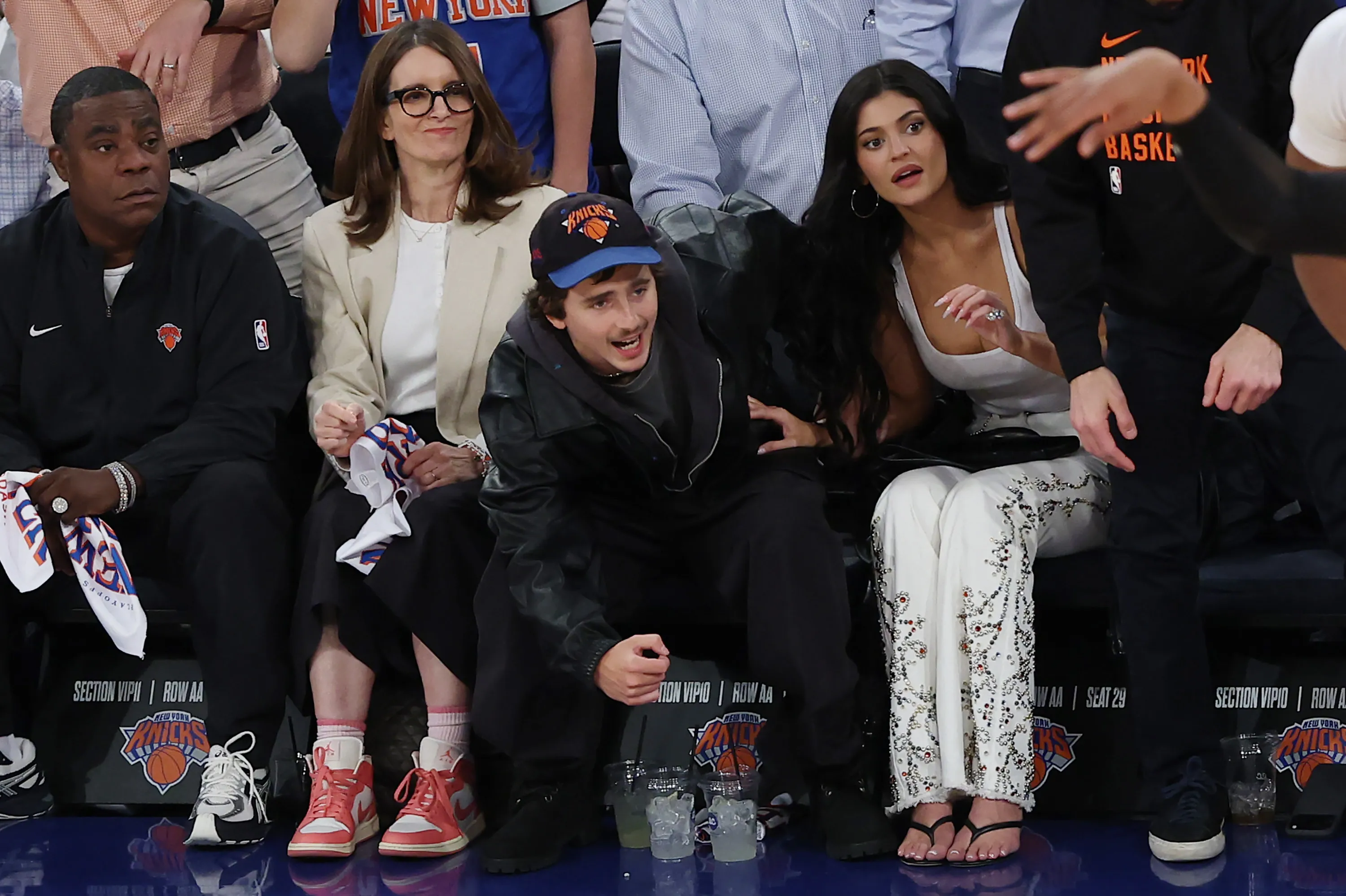 Tracy Morgan, Tina Fey, Timothée Chalamet, and Kylie Jenner sitting courtside at an NBA game.