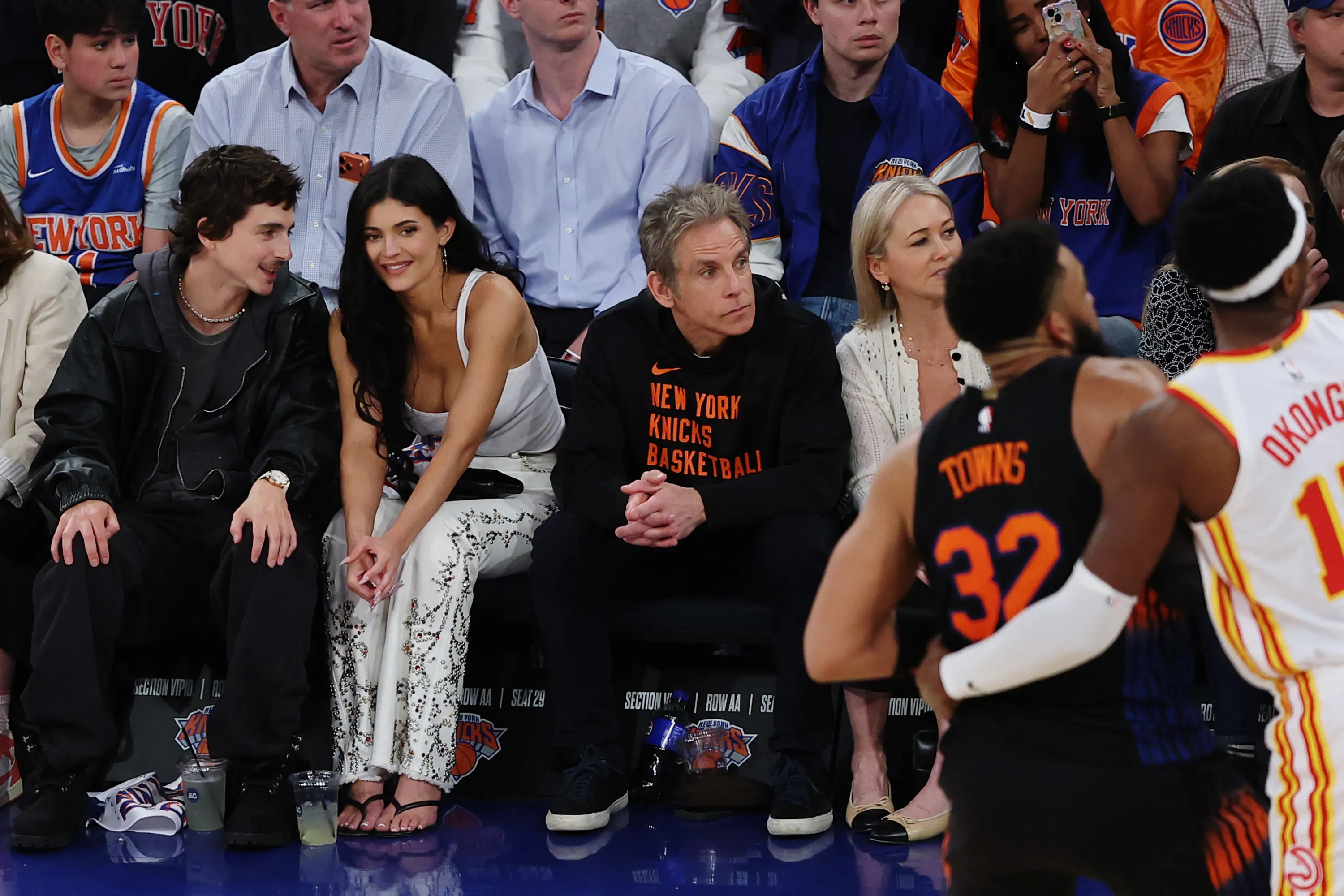 Timothée Chalamet, Kylie Jenner, and Ben Stiller watching the Atlanta Hawks v. New York Knicks basketball game.