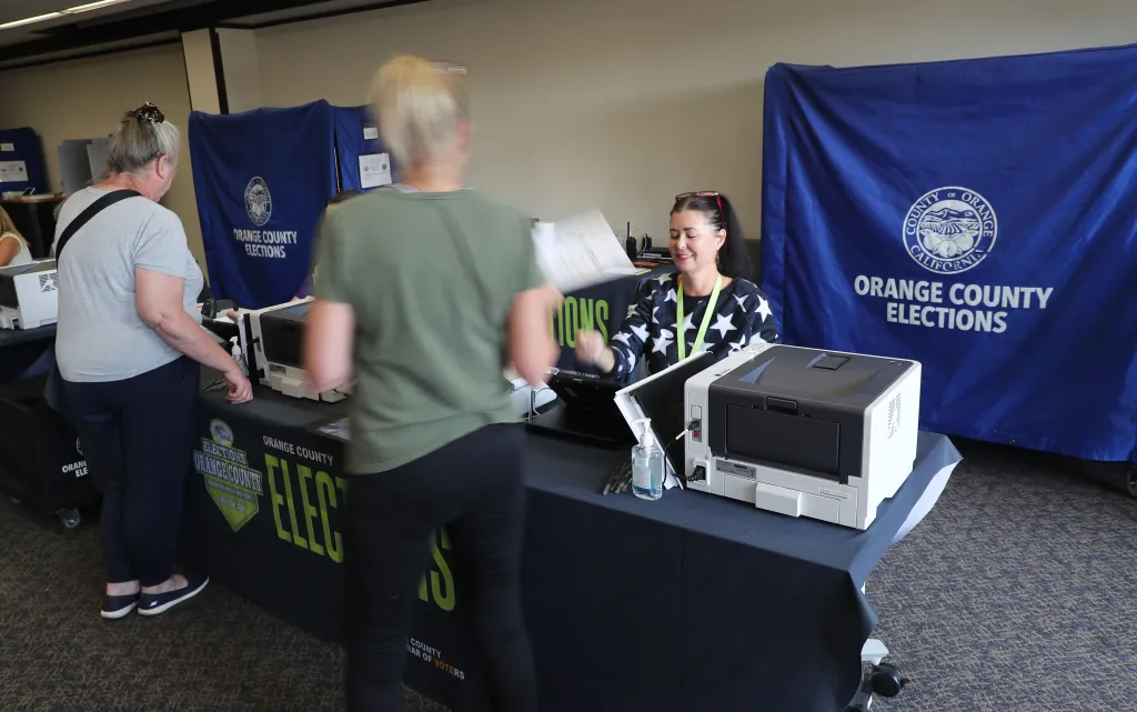 Voters checking in at an Orange County Elections booth.