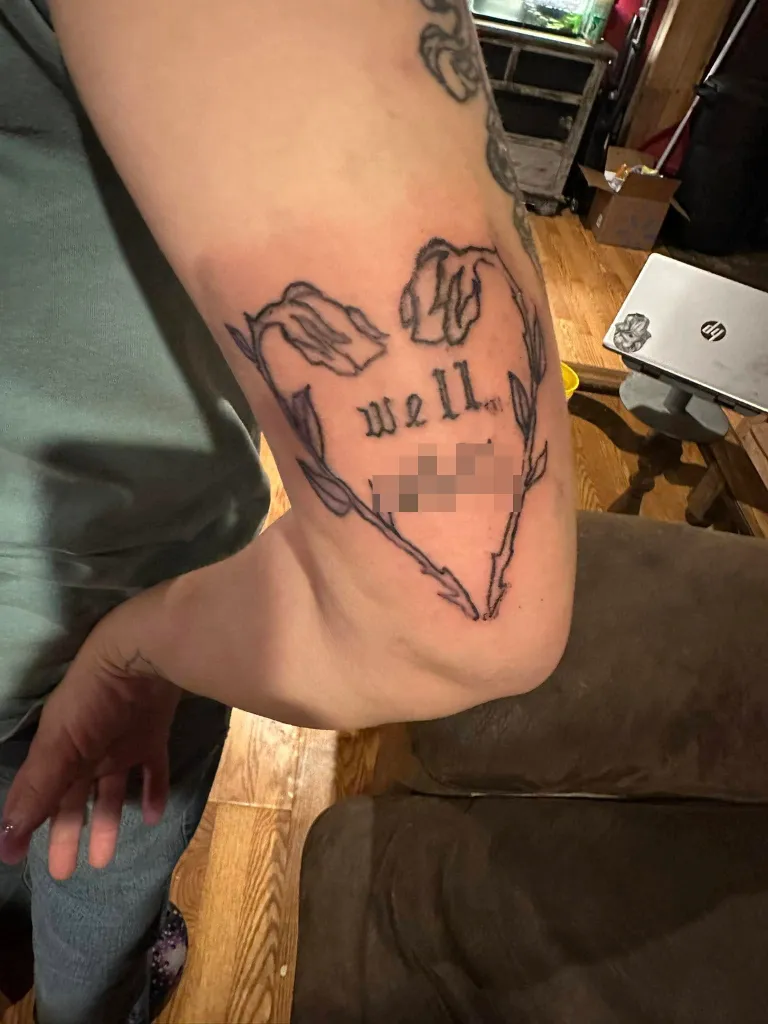 Tattoo on an arm that reads