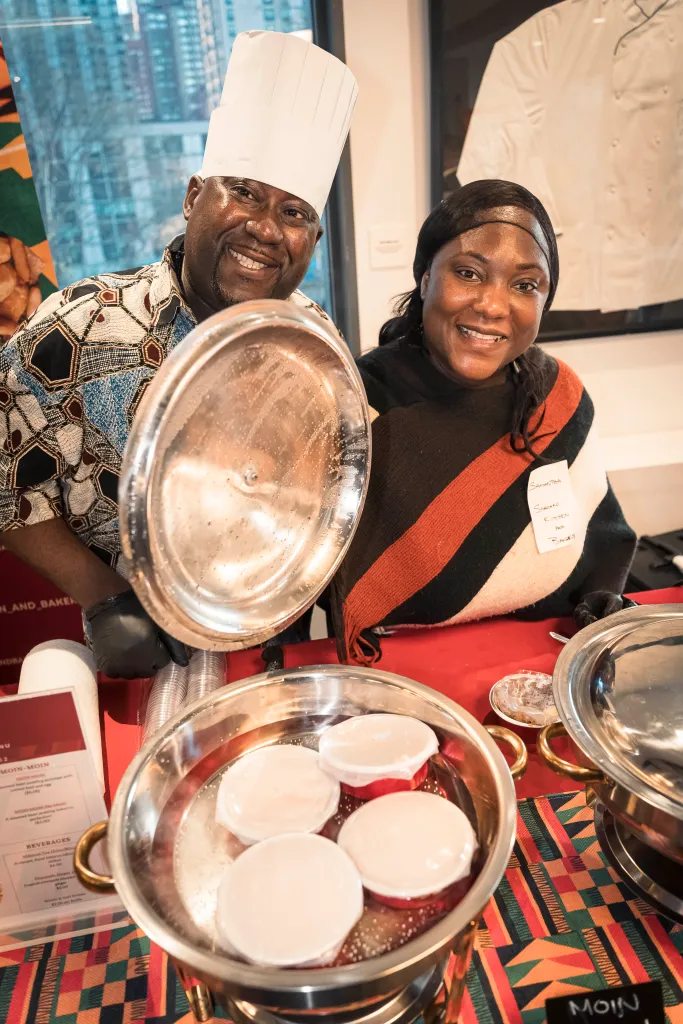 Isaac and Samantha Onuorah, founders of Soronko (West African Meat Pies and Moimoi), posing with their food at Queens Night Market.