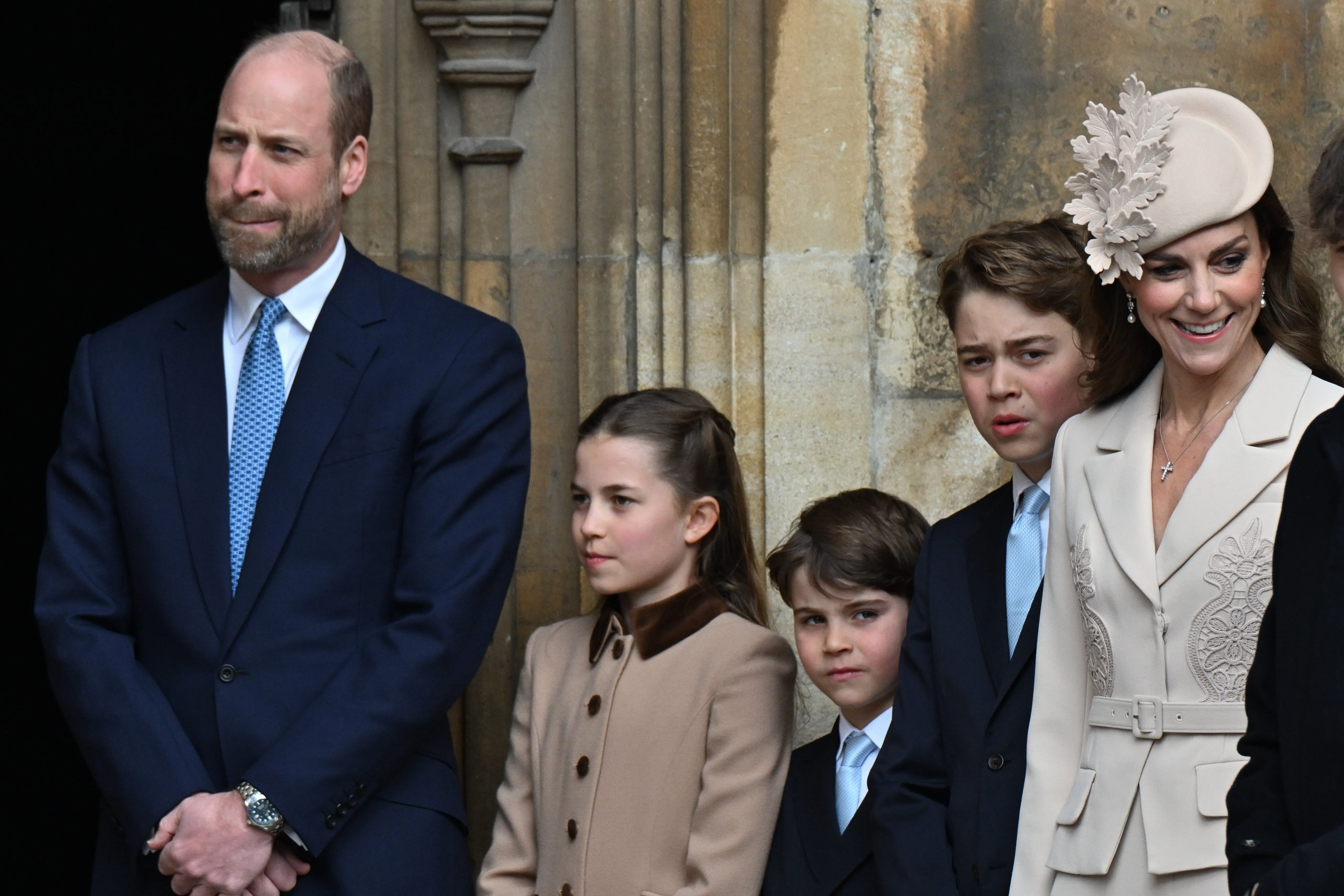 William, Prince of Wales, Catherine, Princess of Wales, and their three children, Prince George, Princess Charlotte, and Prince Louis, attending the Easter Matins Service.