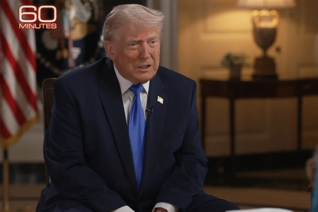 Donald Trump in a dark suit and blue tie during a 