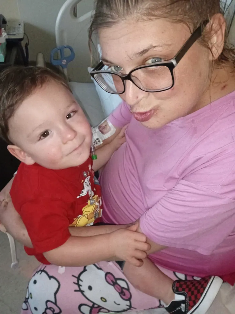 Baby Jaxon and a woman in a hospital.