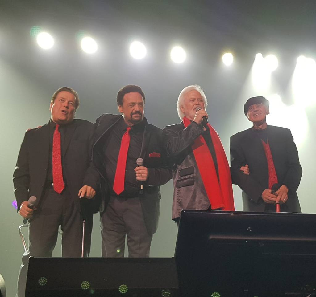 The Osmond Brothers performing on stage.
