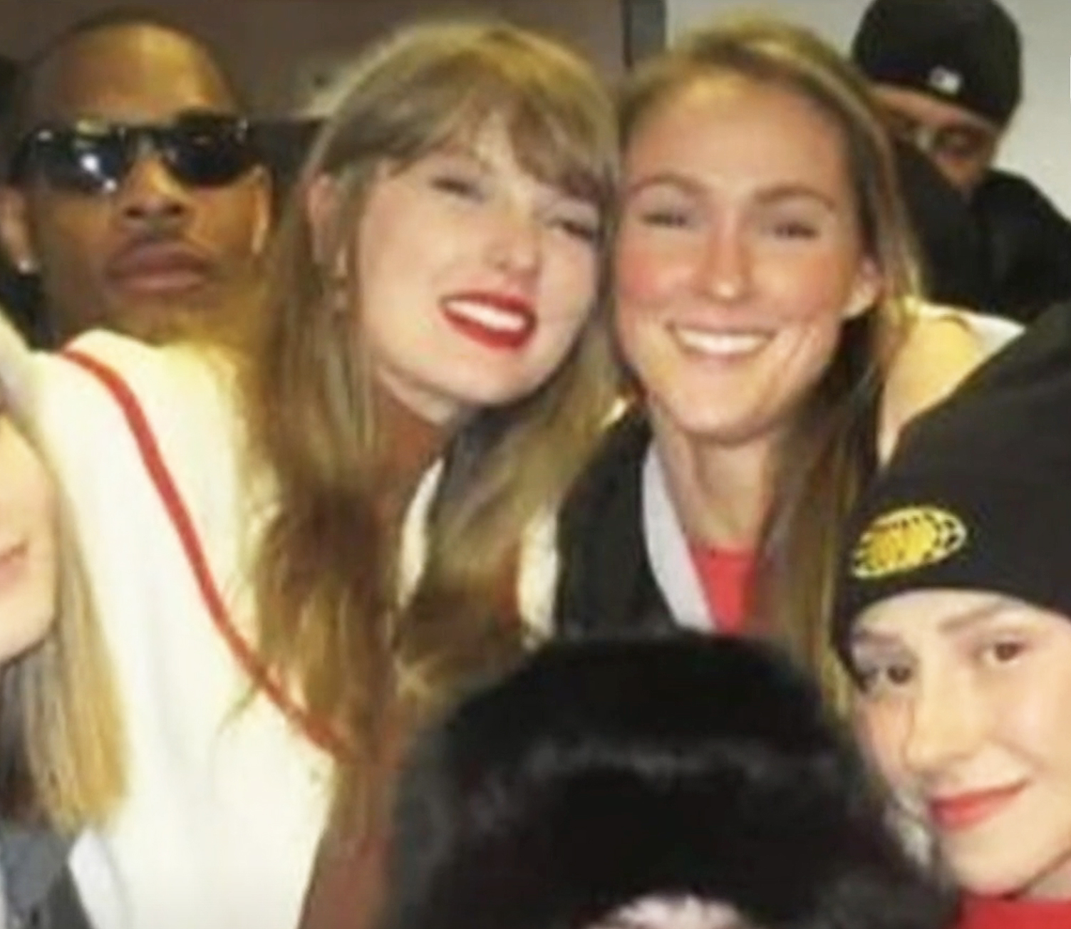 Taylor Swift and Kylie Kelce posing for a photo.