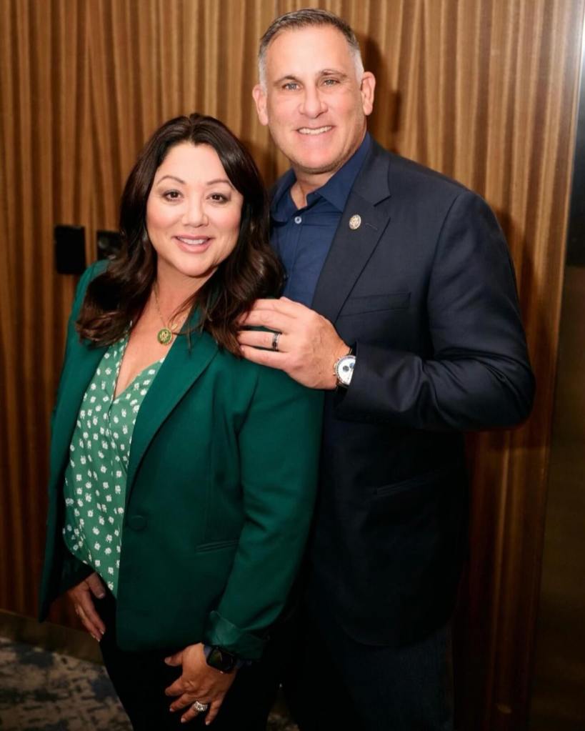 Lori Chavez-DeRemer and Shawn Michael DeRemer smiling at the camera.