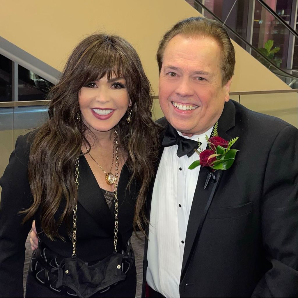 Marie Osmond and Alan Osmond smiling at the camera.