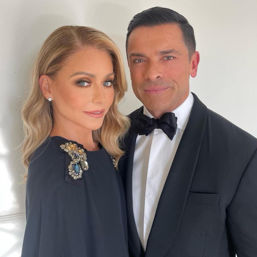 Kelly Ripa and Mark Consuelos posing together in formal attire.