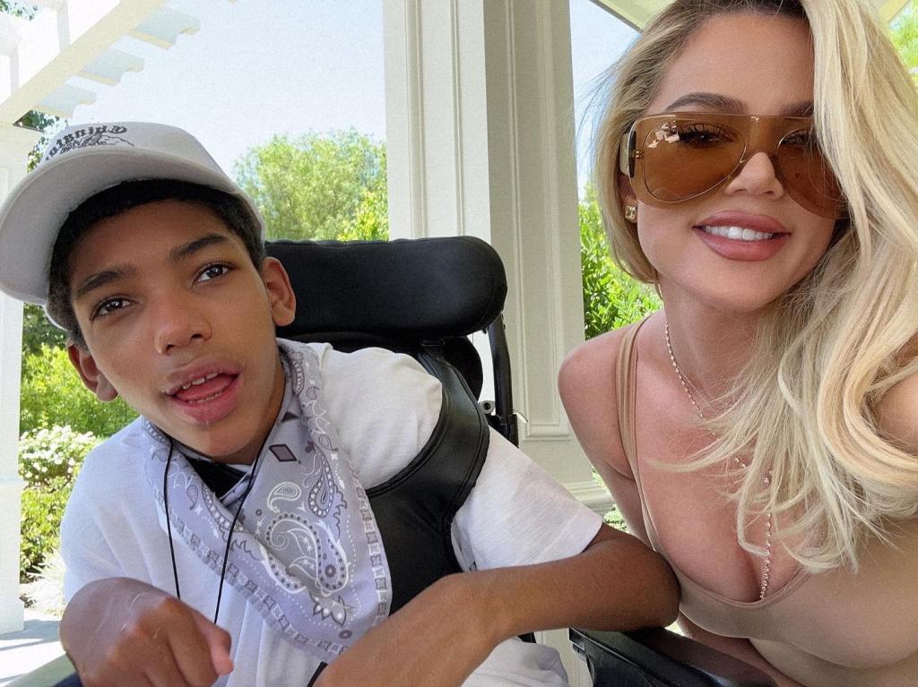 Khloe Kardashian poses for a selfie with Amari, Tristan Thompson's brother, who is in a wheelchair.