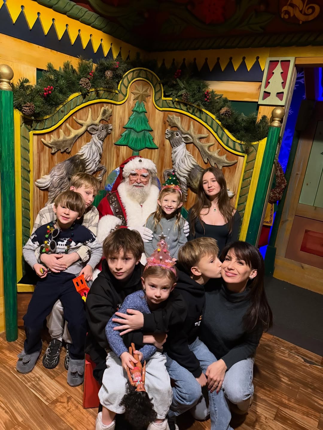 Hilaria Baldwin and her seven children visiting Santa.