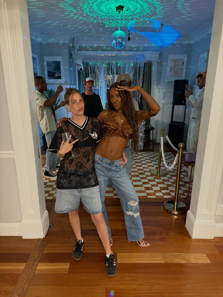 Amanda Batula and Ciara Miller posing at a party.