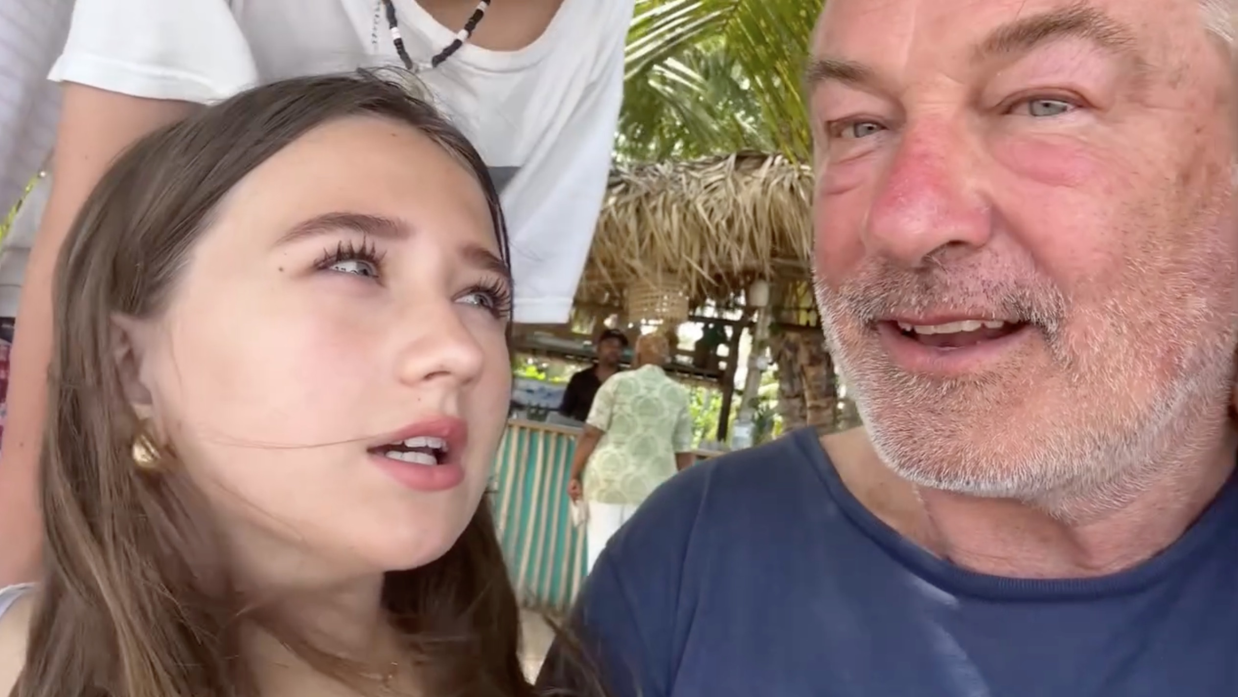 Alec Baldwin and his daughter chatting together, smiling.