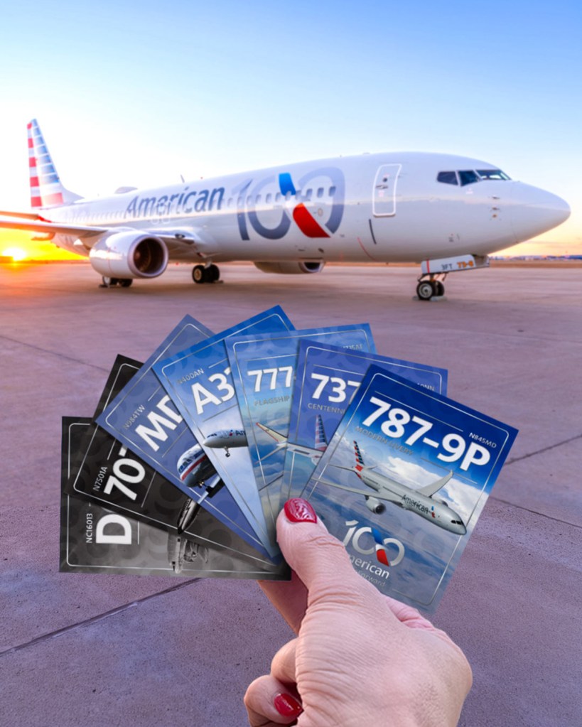Hand holding American Airlines trading cards featuring various airplane models with an American Airlines plane in the background.