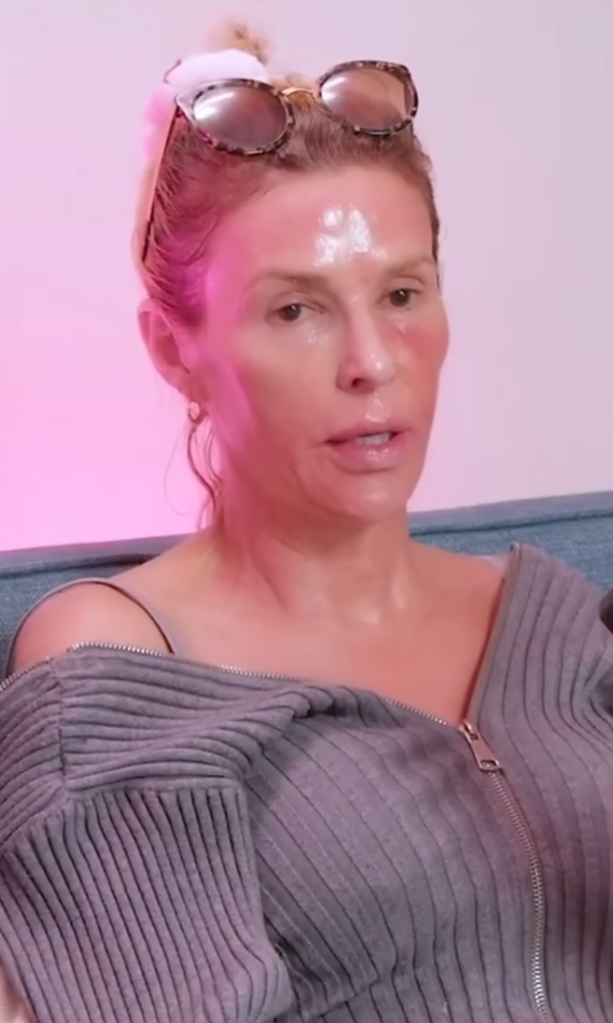 Brandi Glanville with sunglasses on her head, looking directly forward.