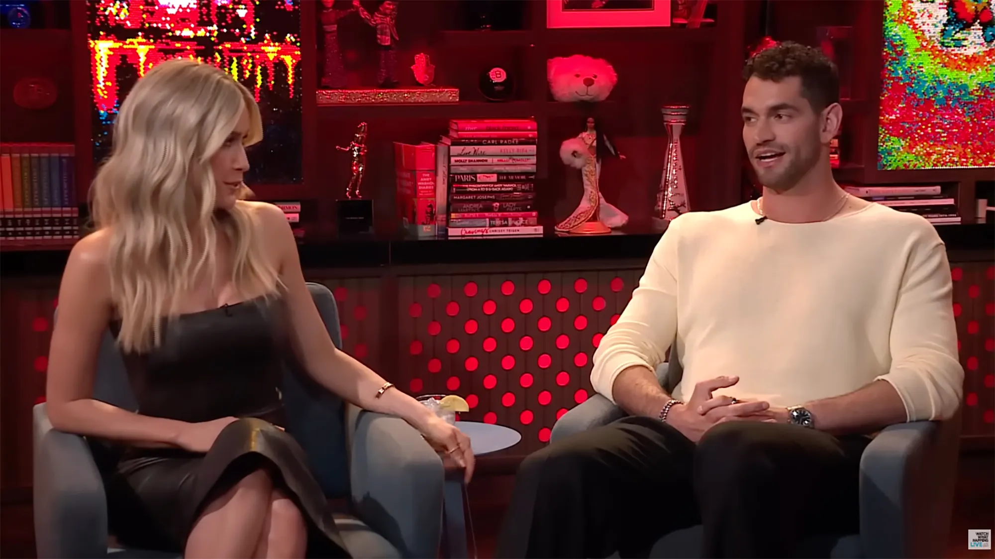 Jesse Solomon from Summer House sitting in a chair next to a blonde woman.