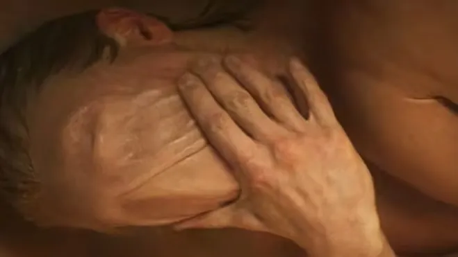 Matt Hagen's face is disfigured and appears to be made of clay, with a hand pressing into his cheek.