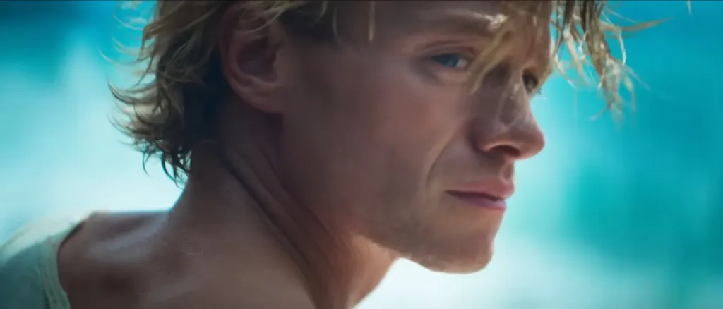 Close up of actor Tom Rhys Harries as Matt Hagen, looking off-screen right.