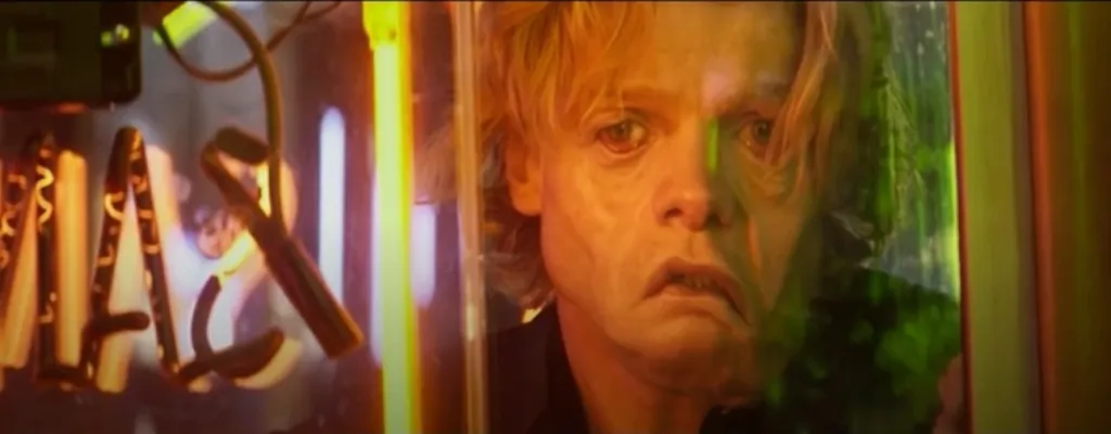 Matt Hagen as Clayface with a disfigured face, looking distressed.