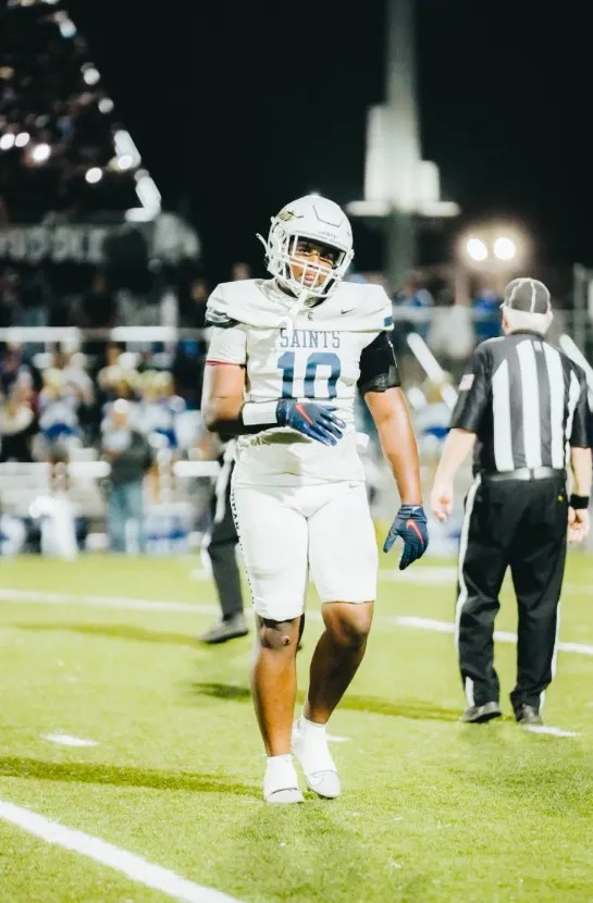 Ryder Barnes, wearing a white football uniform with 