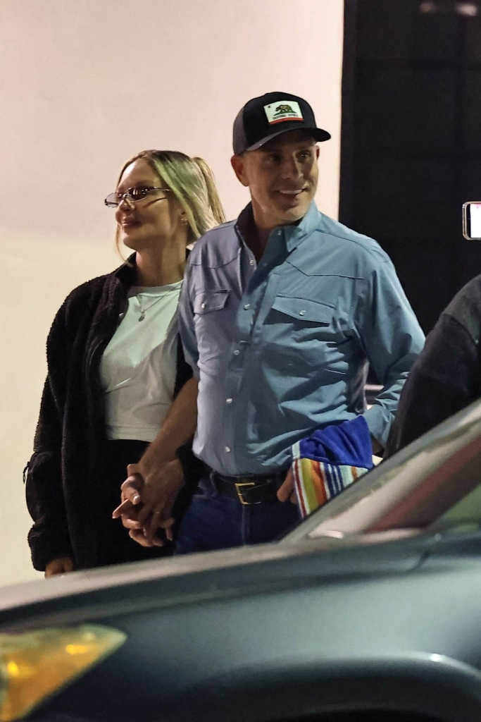 Hunter Biden and Melissa Cohen smiling and holding hands after dining at Matsuhisa.