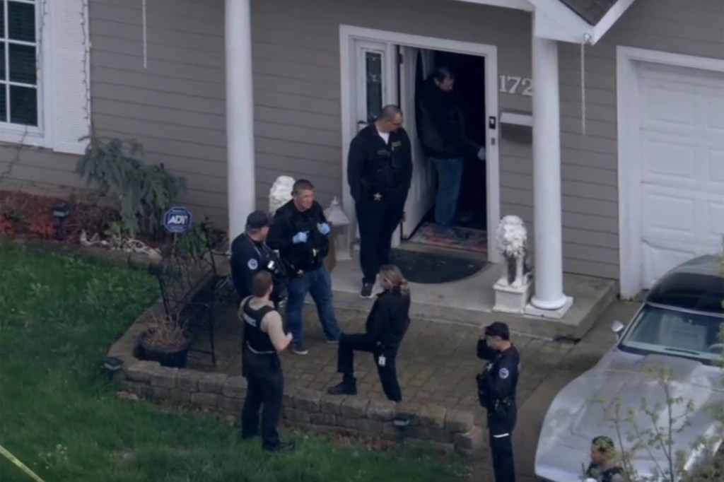Police and forensic personnel at a home in Schaumburg, Illinois.