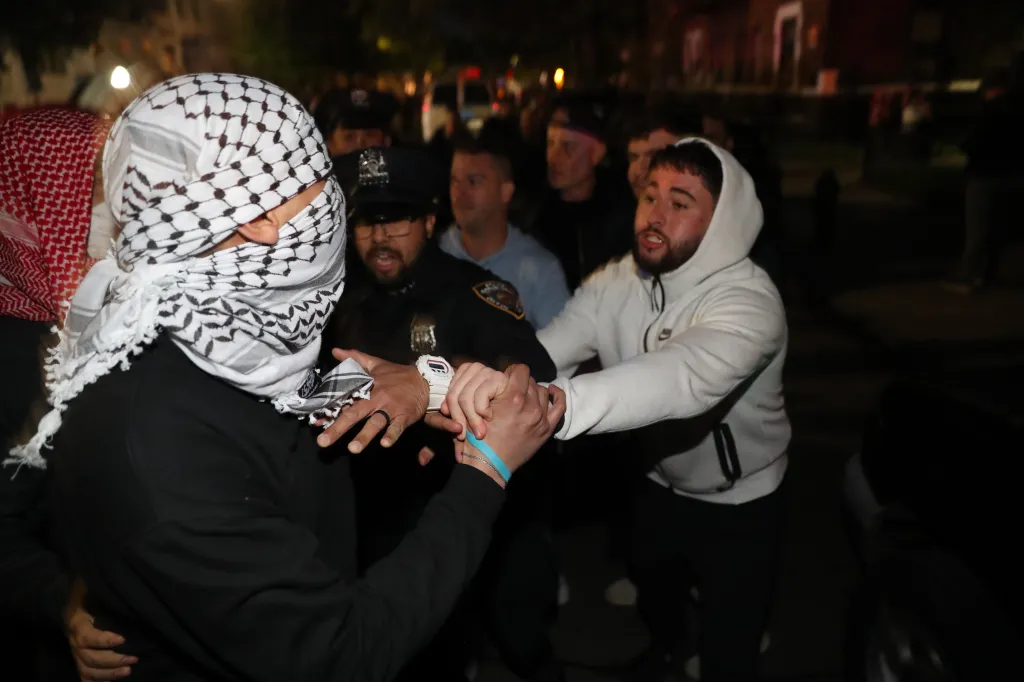 Police and protesters supporting Israel and Palestine clash near Young Israel Synagogue of Midwood during protest of 