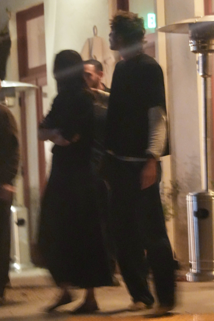 Jacob Elordi rubbing Kendall Jenner's back during a double dinner date.