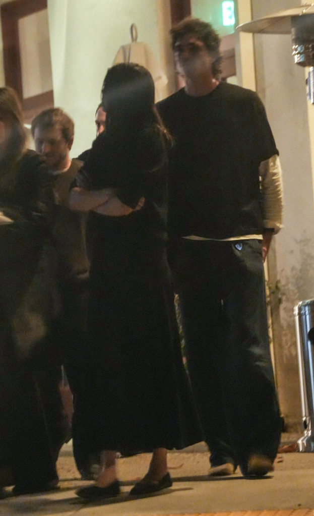 Jacob Elordi rubbing Kendall Jenner's back during a double dinner date.