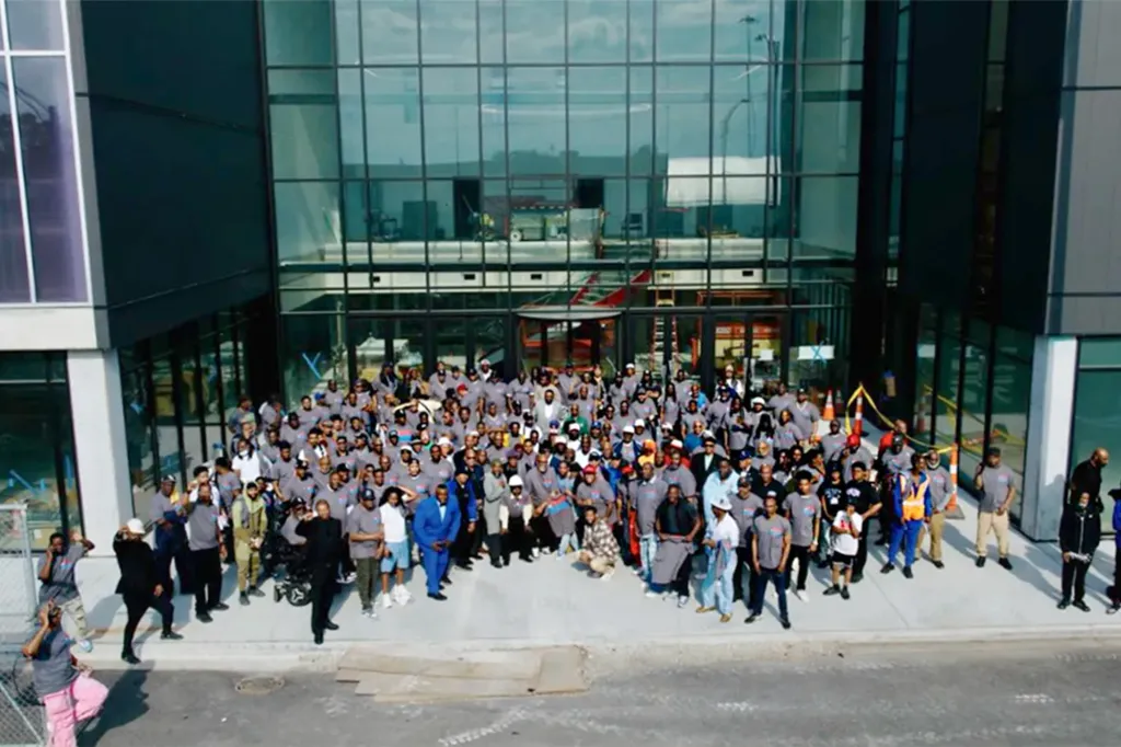 Hundreds of men gather outside the nearly completed Robert R. McCormick Leadership & Economic Opportunity Center during Pastor Corey B. Brooks’