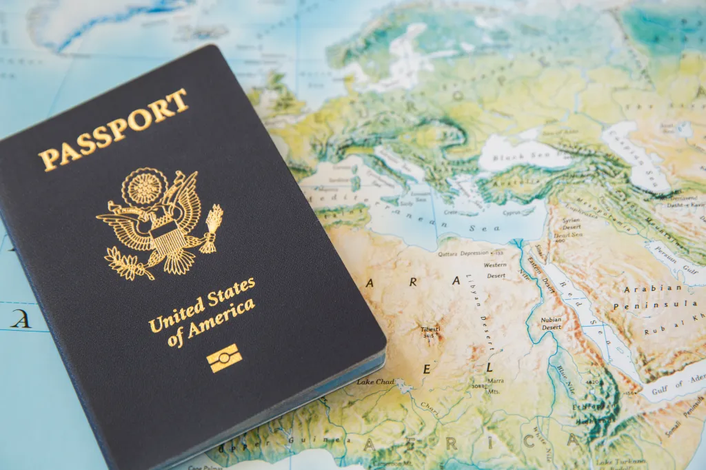 US passport on a world map.