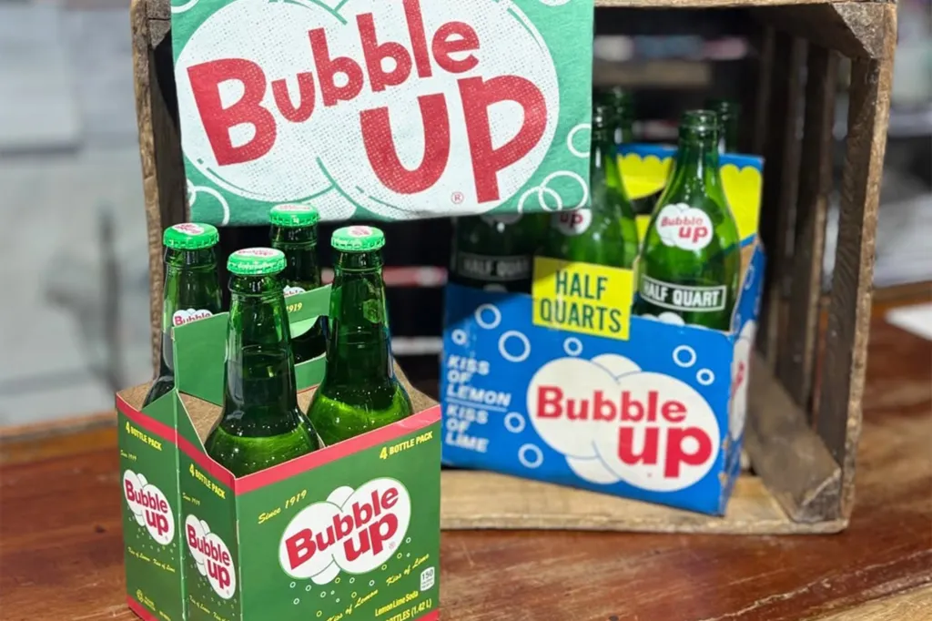 Bubble Up soda bottles in green 4-packs and blue 