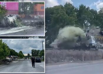 Horror as train collides with truck carrying septic tank, seriously injuring driver: video