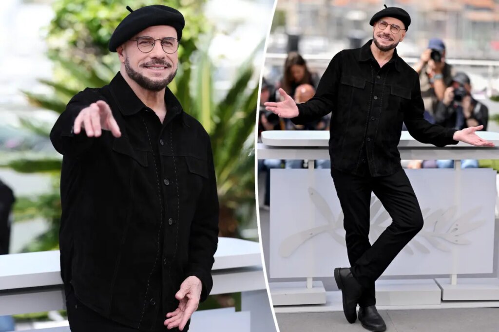 John Travolta models another kooky beret at Cannes hours after being trolled for striking new look