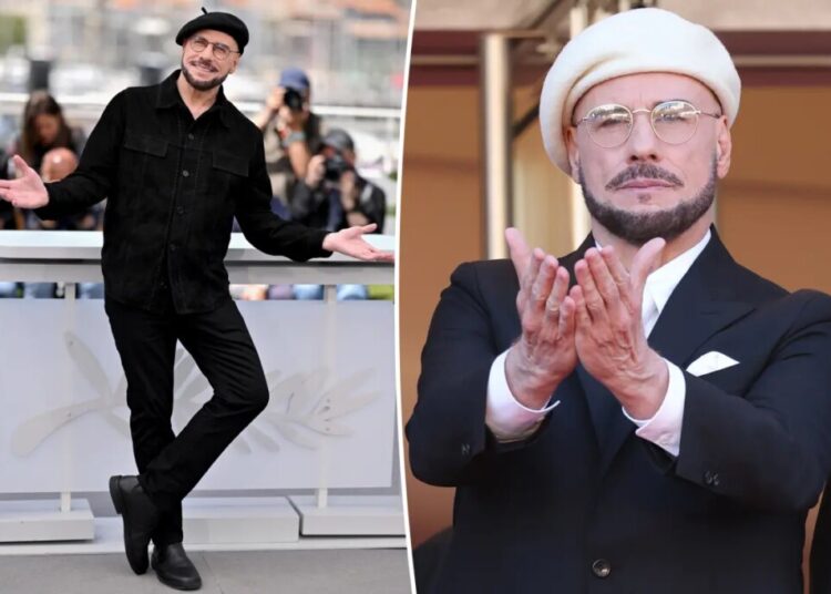 John Travolta reacts to attention his viral Cannes beret looks have gotten