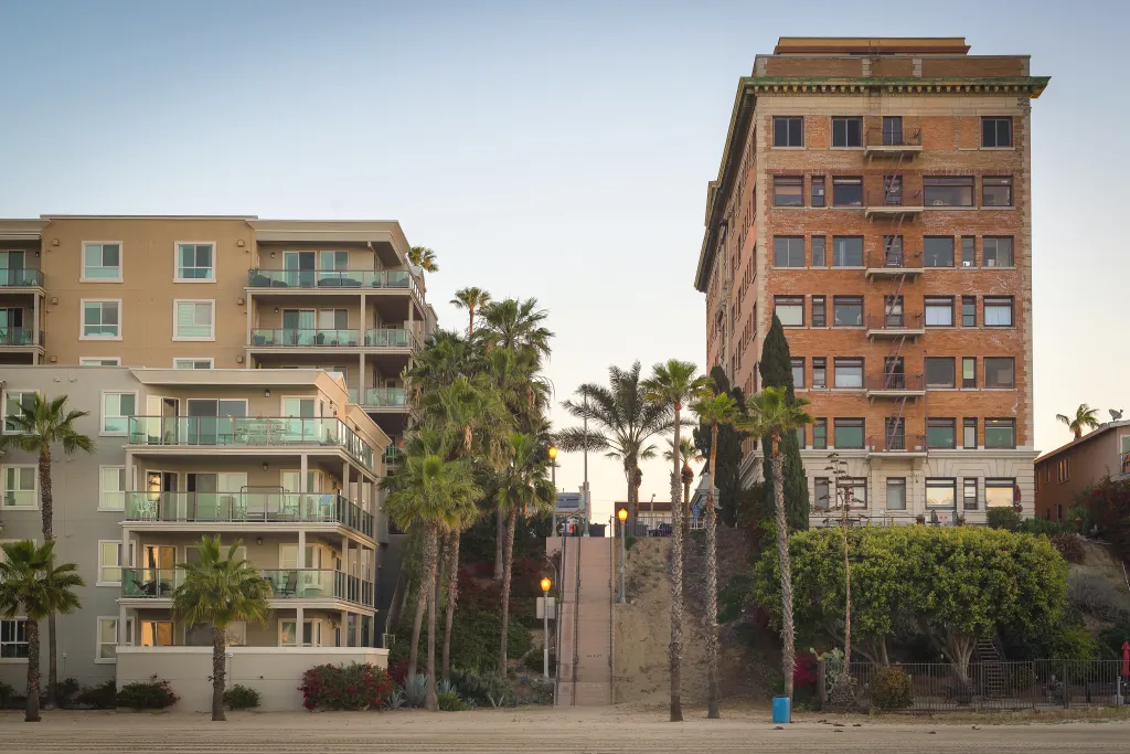 Apartment buildings and palm trees in Los Angeles, California.