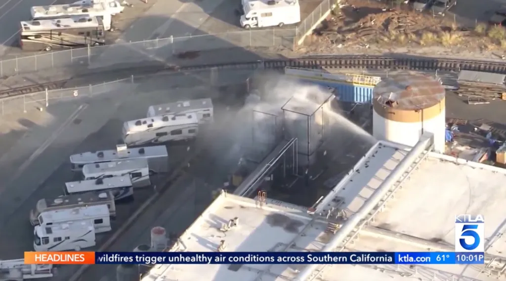 Water spraying on a facility where a 34,000-gallon storage tank of methyl methacrylate leaked into the air.