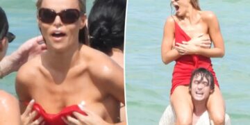 Brooks Nader suffers wardrobe malfunction in the ocean during Miami Swim Week