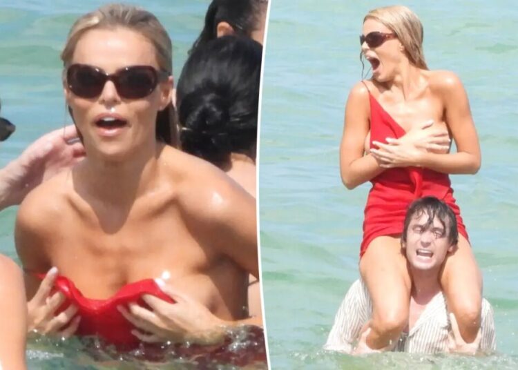 Brooks Nader suffers wardrobe malfunction in the ocean during Miami Swim Week