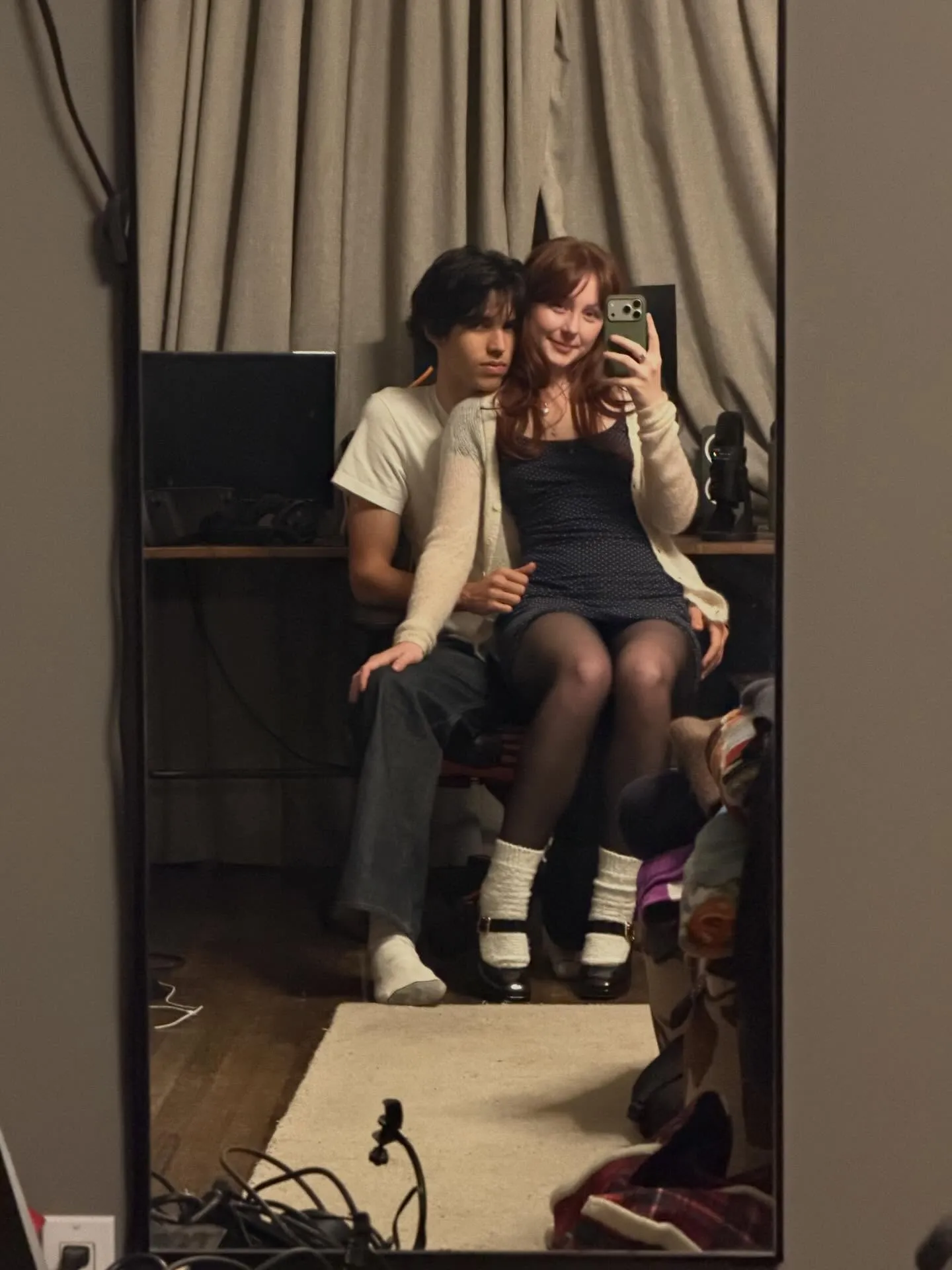 Four men smiling in front of palm trees.