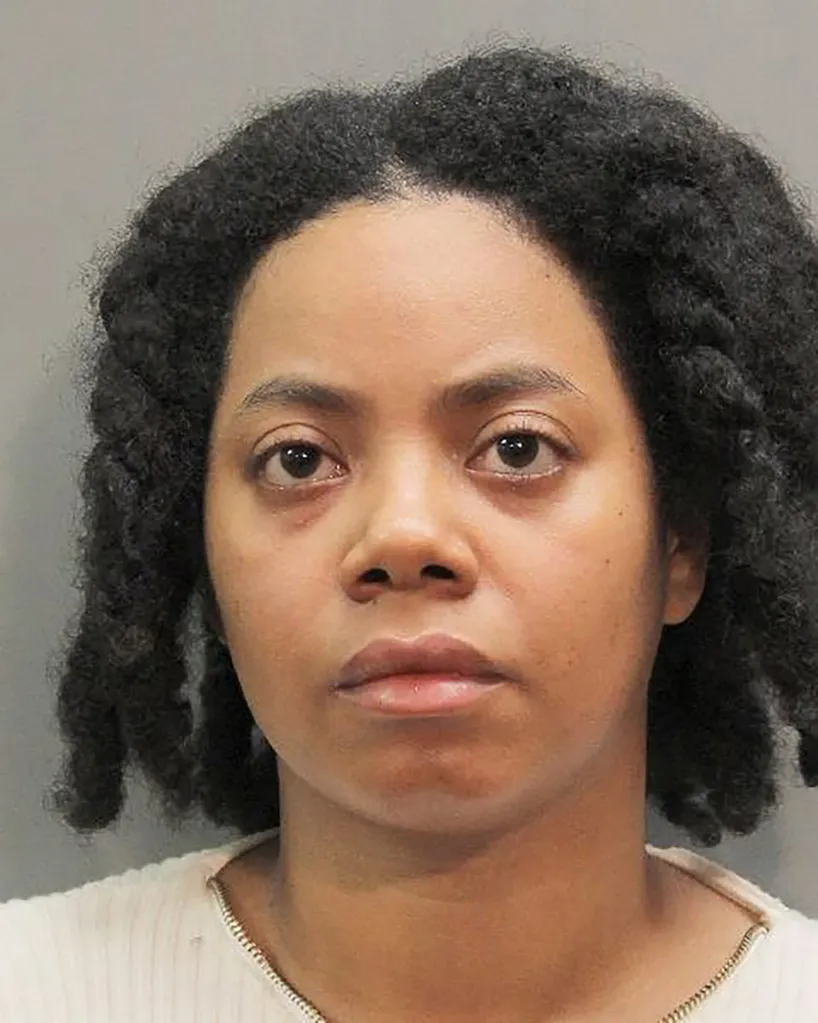 Mugshot of Amanda A Fraser, a woman with dark, curly hair and light brown skin, wearing a white collared top.