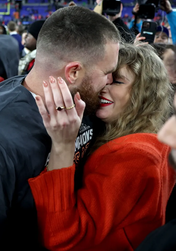Travis Kelce of the Kansas City Chiefs celebrating his AFC Championship win with Taylor Swift.