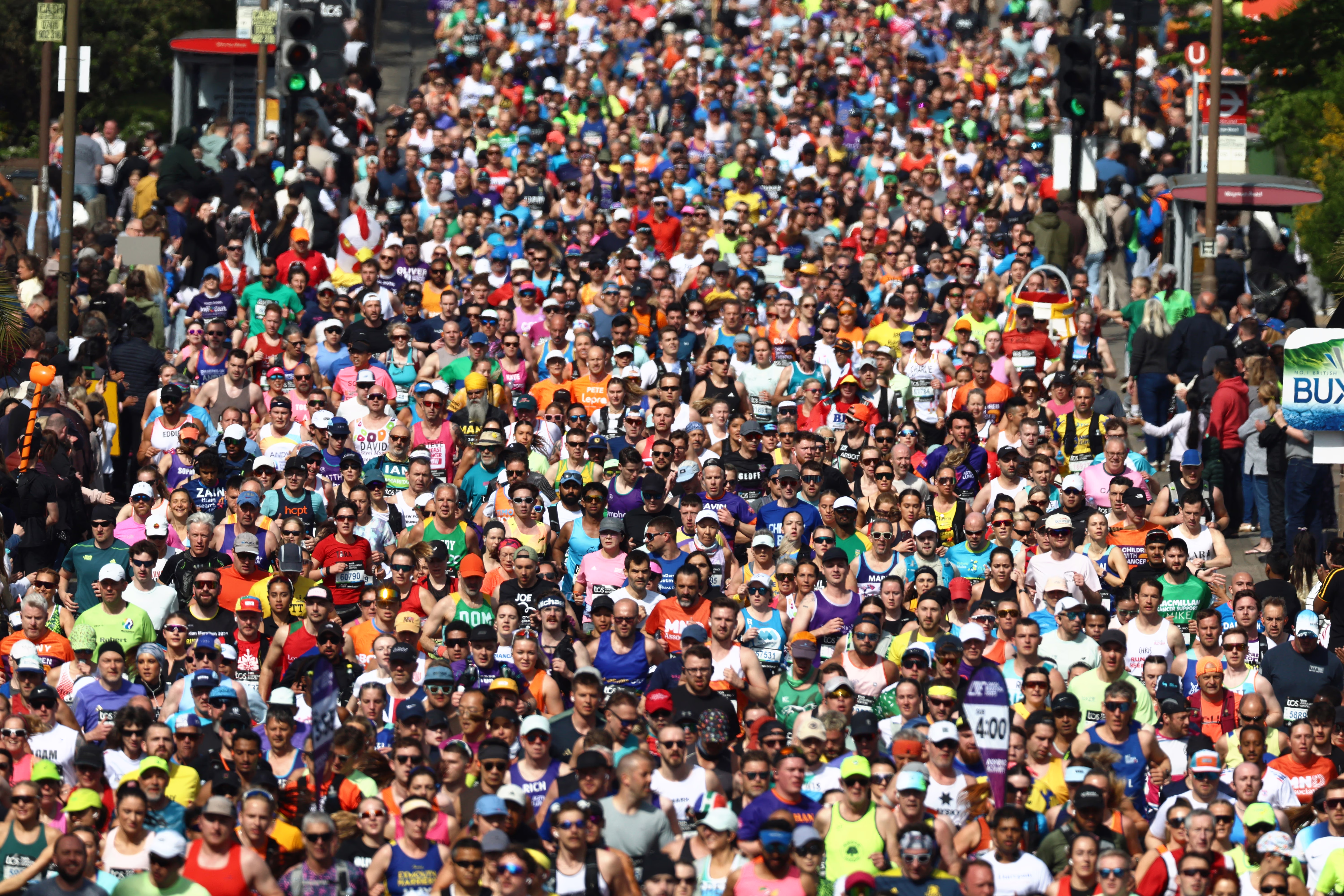 Runners fill a street, running in a marathon.
