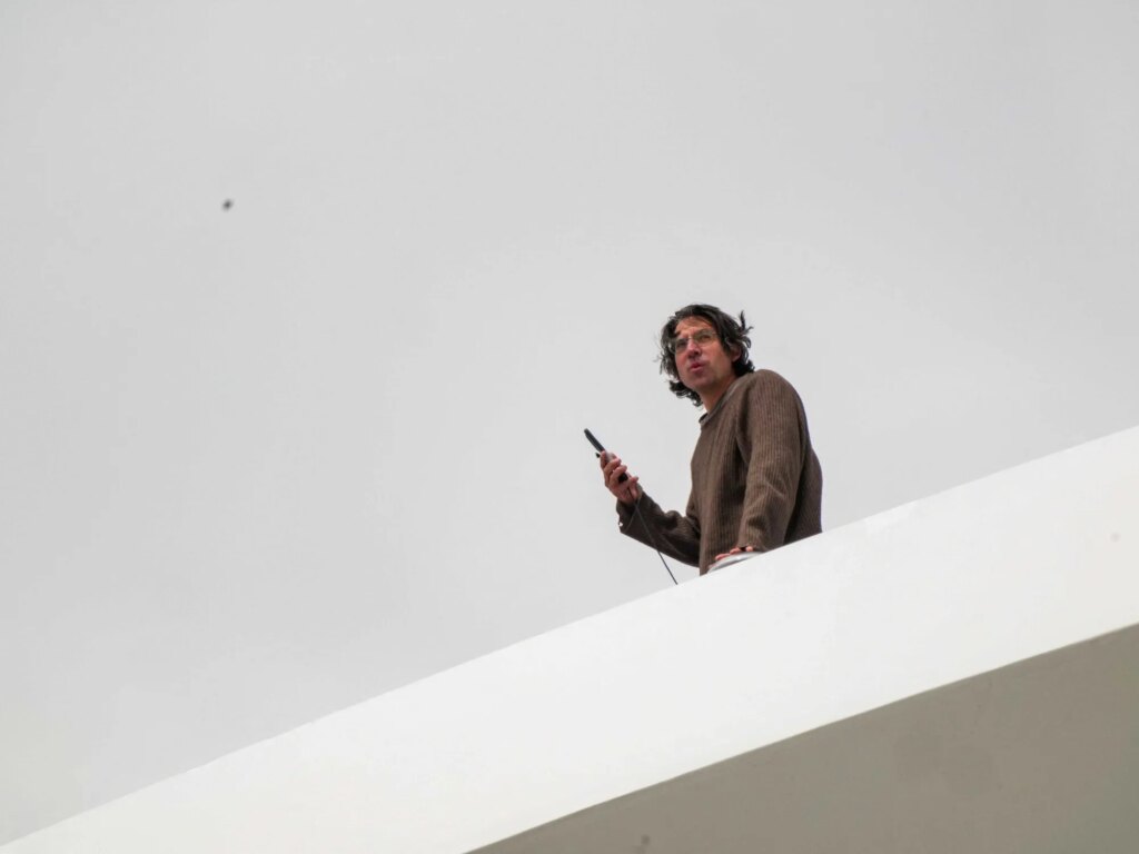Activist scales DC bridge in protest of Trump’s ‘colossal failure’ Iran war